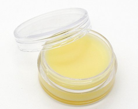 Geopend potje waxolie voor houtverzorging, meegeleverd bij de Snijplank Acacia S500